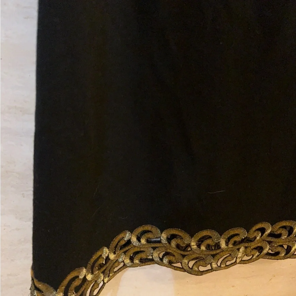 Free People sleeveless black dress with gold metallic embroidery.